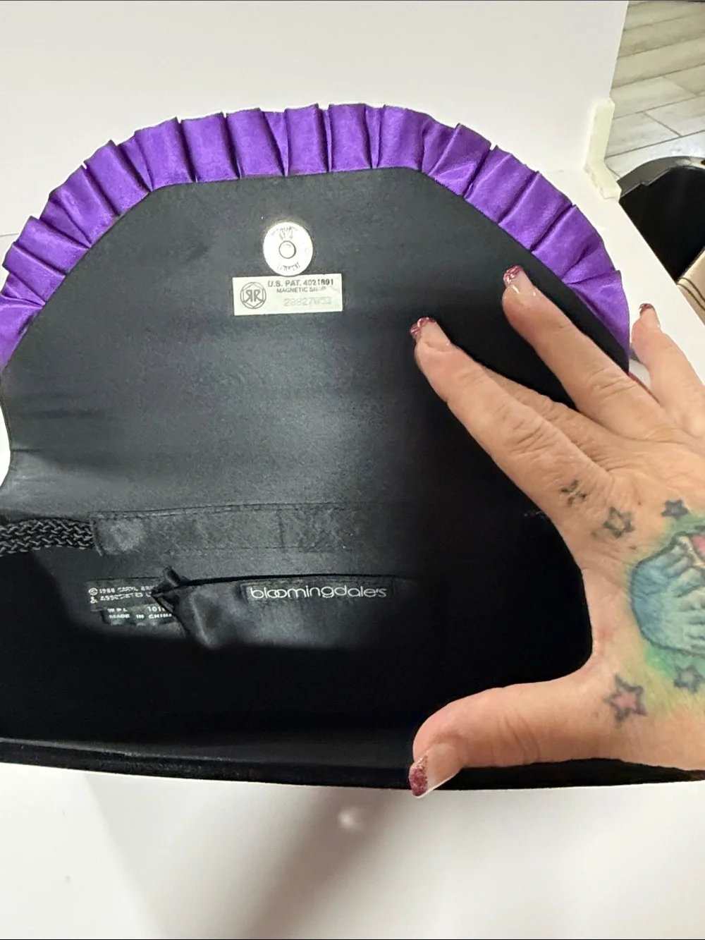 Bloomingdale’s Black Evening Clutch with Purple Ribbon Trim